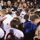 Football coach Joe Kennedy leading a prayer circle on October 16, 2015.